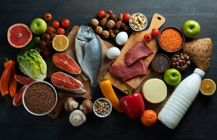 Top view of an assorted food pyramid on a black background. 